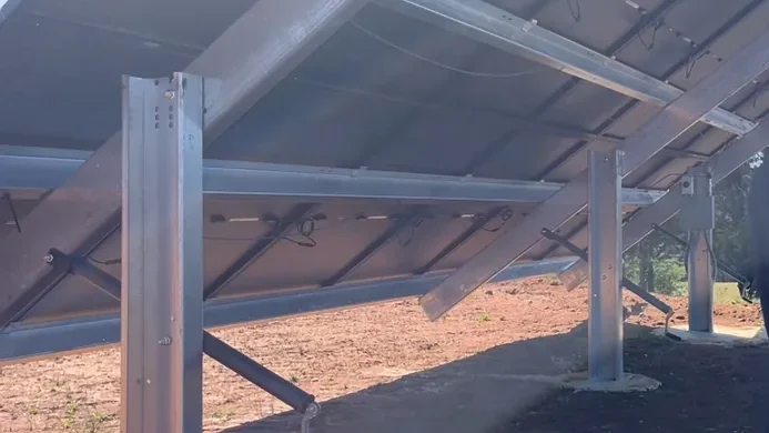 Man inspecting solar ground mount structure