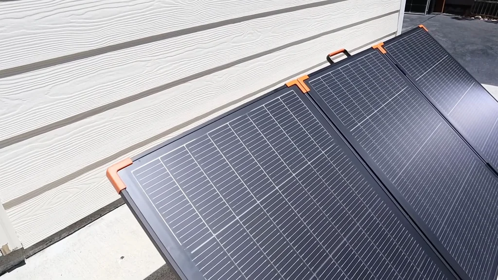 Portable solar panels leaned against a wall for inspection