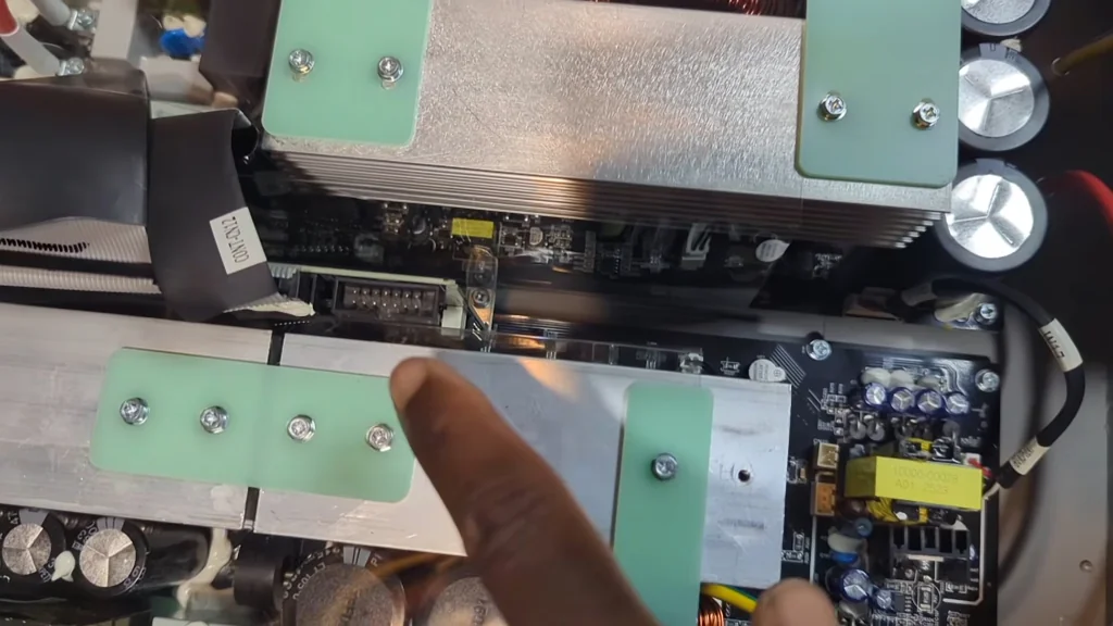 Internal view of the inverter showing the heatsink array and power components.
