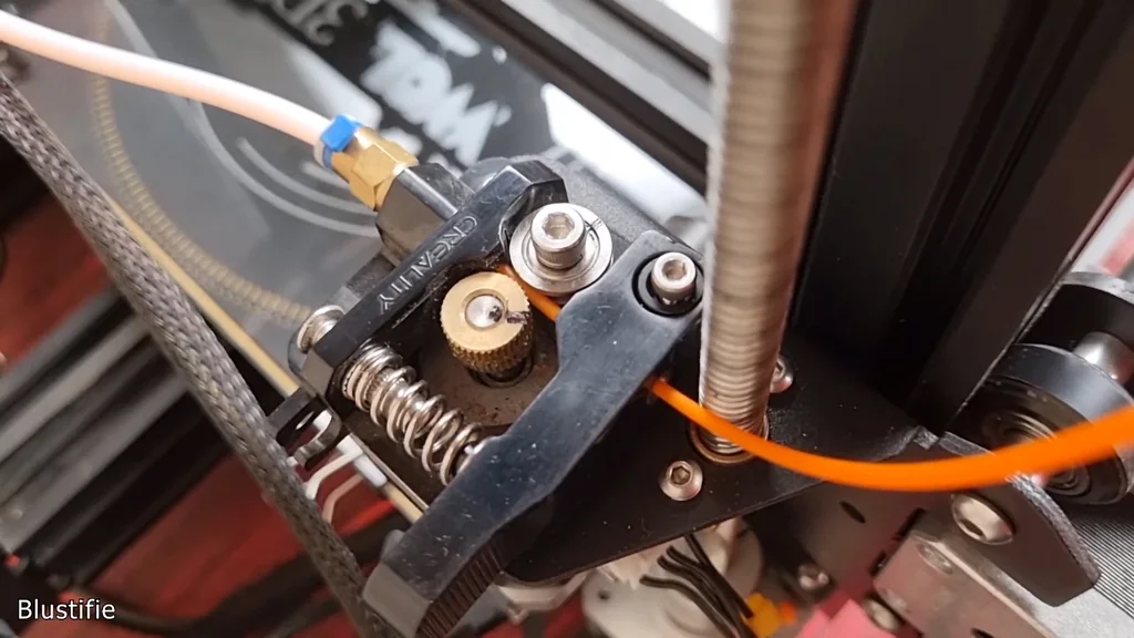Close-up of the cracked plastic extruder arm