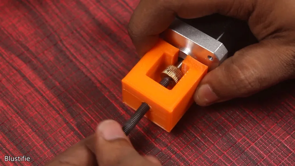 Assembling the new metal extruder onto the motor