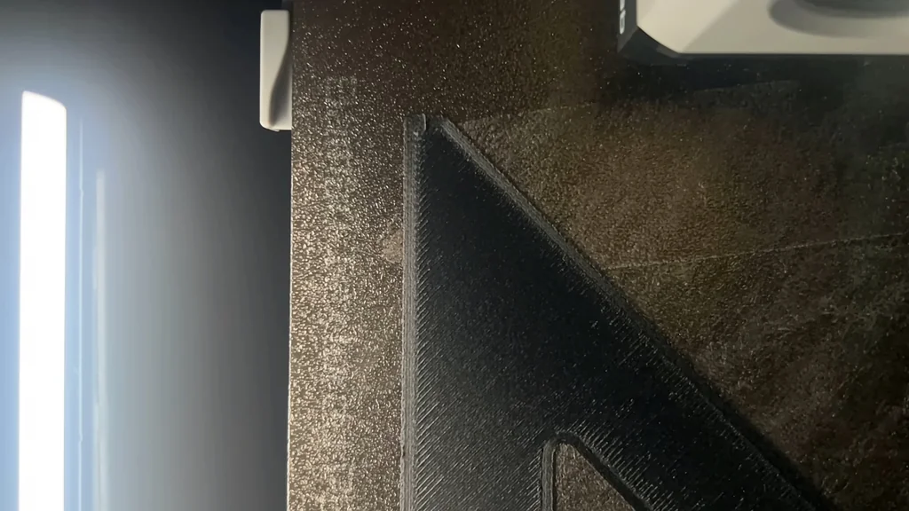 3D printer printing black PA6-CF part
