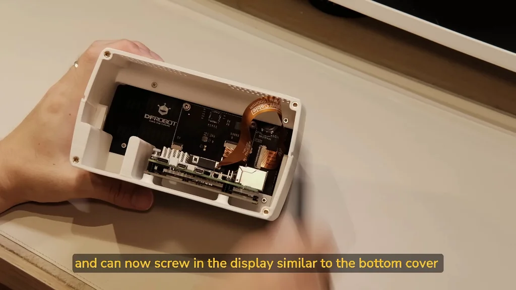Screwing the display into the 3D printed case
