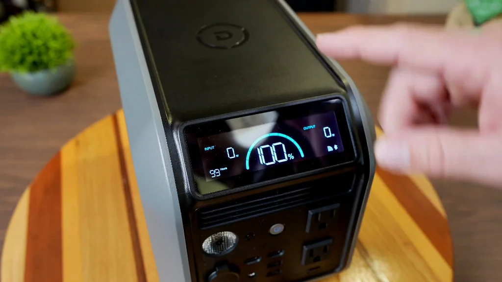 LCD display showing 100% capacity