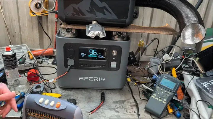 Multimeter probes testing earth ground continuity on modified UK plug shell
