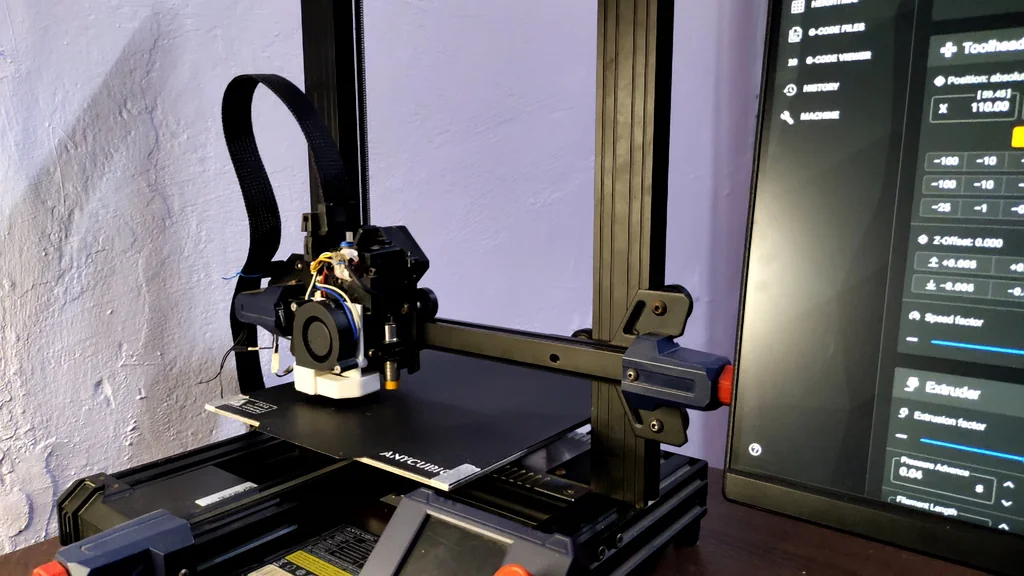 3D printer in operation printing a test object