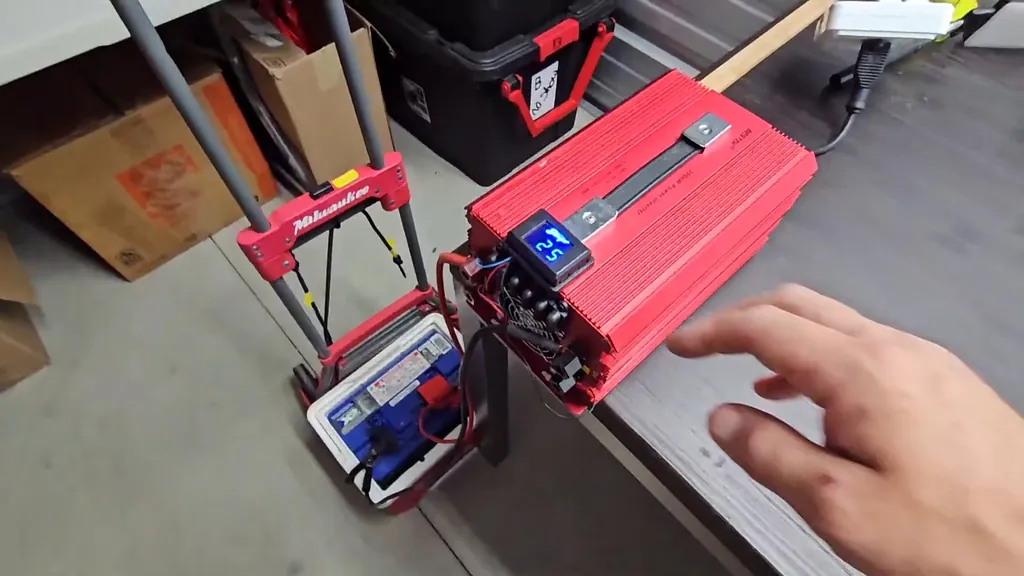Bestek 2000W power inverter connected to a battery with an external voltage display.