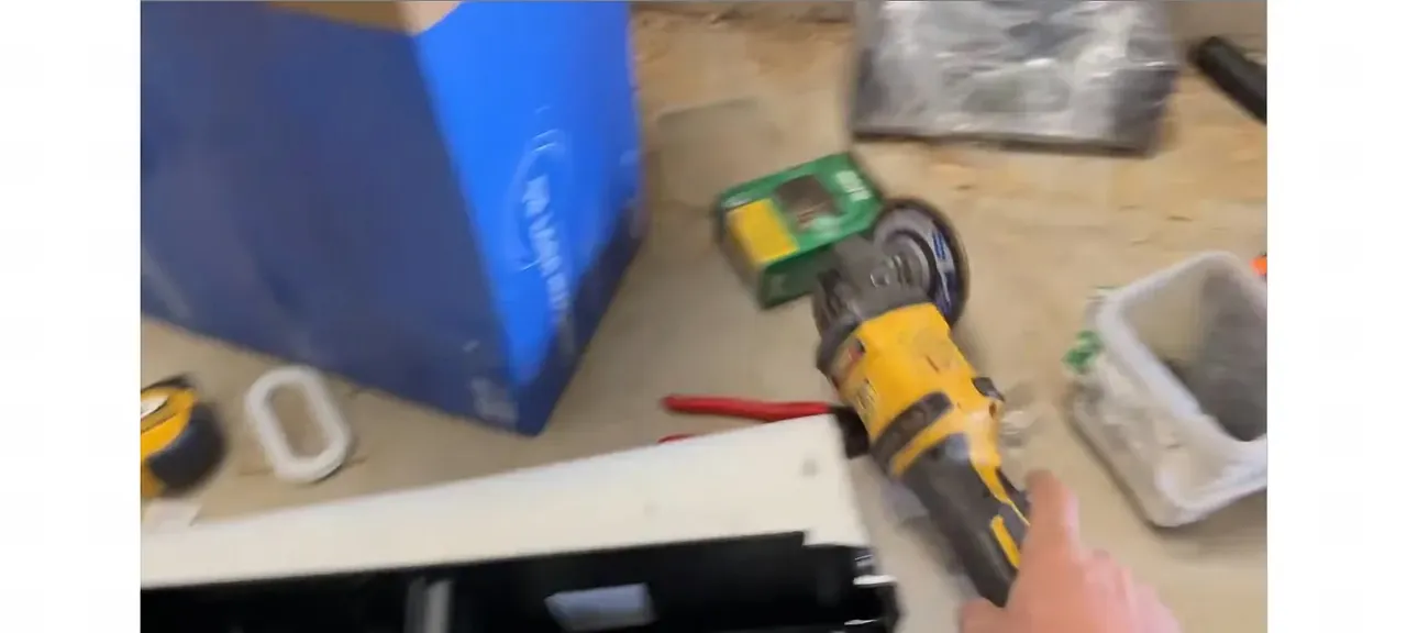 Using a grinder with a flap disc on the screw tips