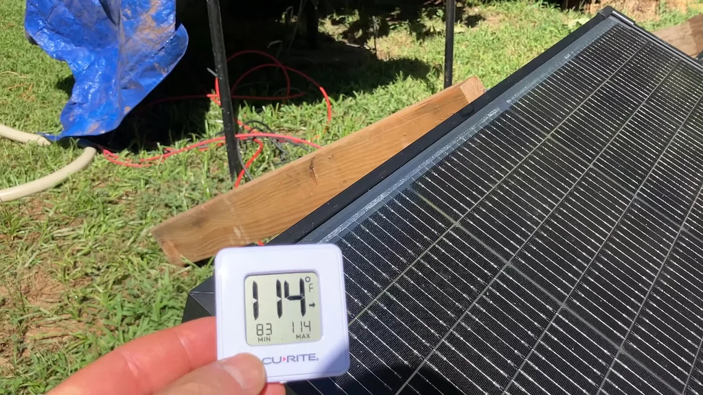 Accu-Rite thermometer showing 114F on solar panel