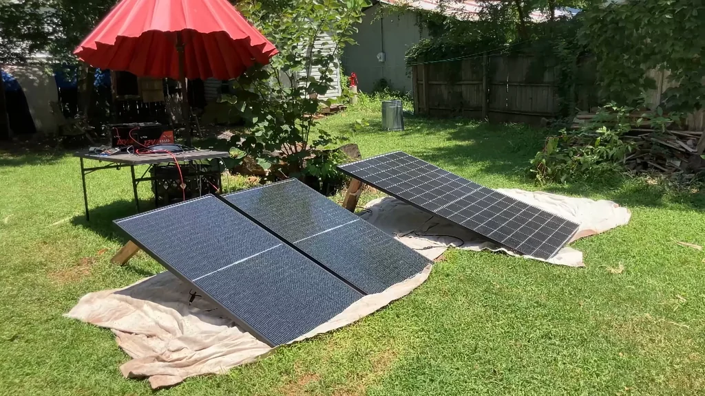 Rear view of solar panels on wooden stands