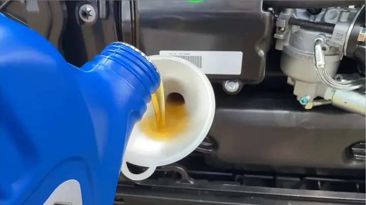 Pouring fresh 10W-30 motor oil into generator fill port using angled funnel