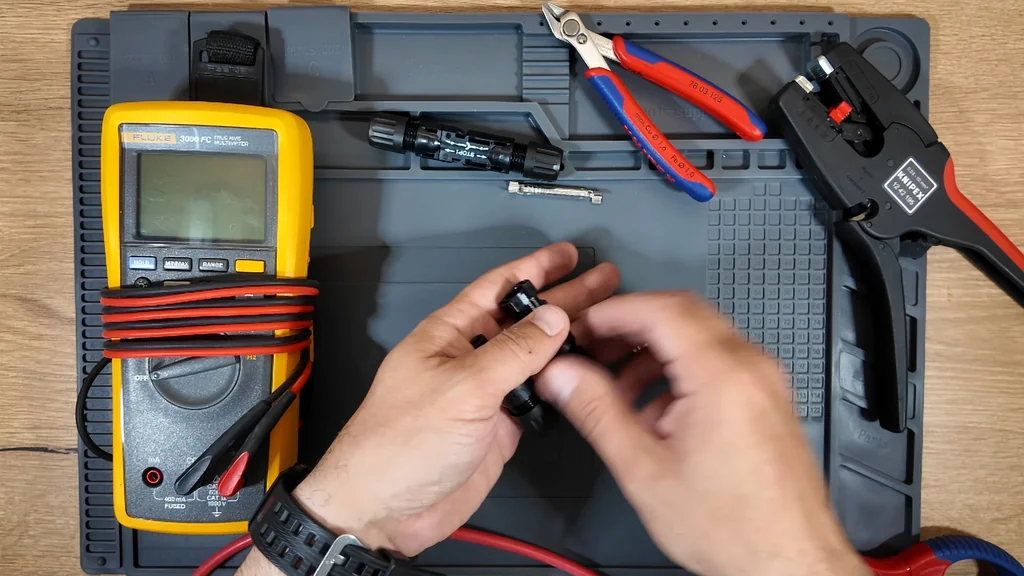 MC4 connector components arranged on a rubber work mat