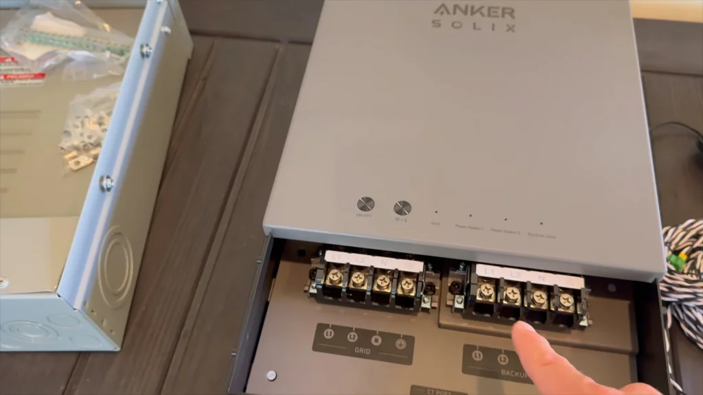 Hands connecting the power cable to the Anker SOLIX F3800 Plus