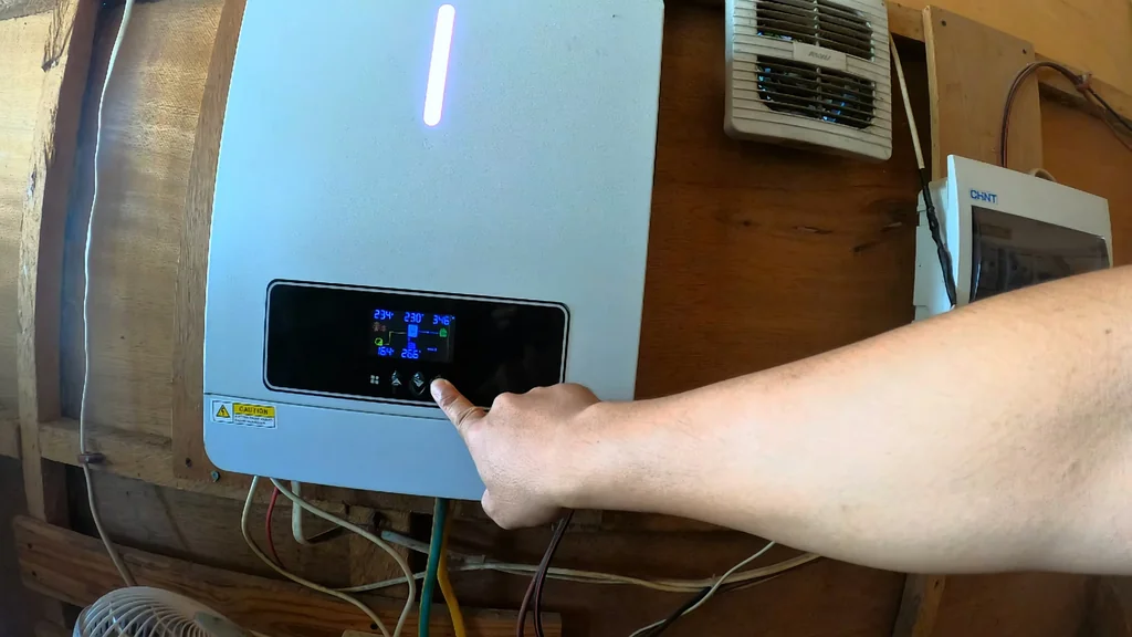 Adjusting inverter settings on the LCD display.