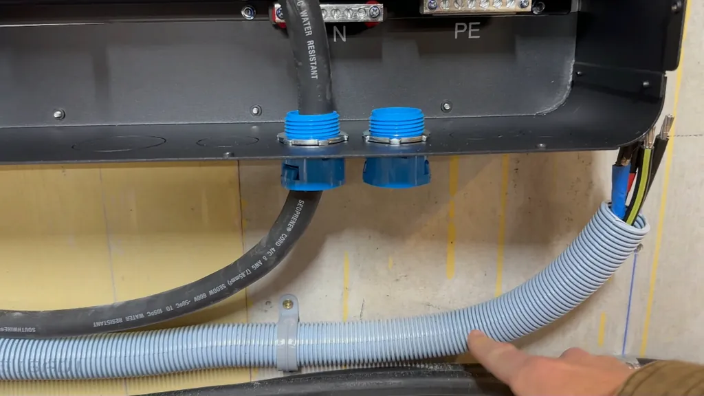 Close-up of 1-inch ENT connector installed on the inverter housing.