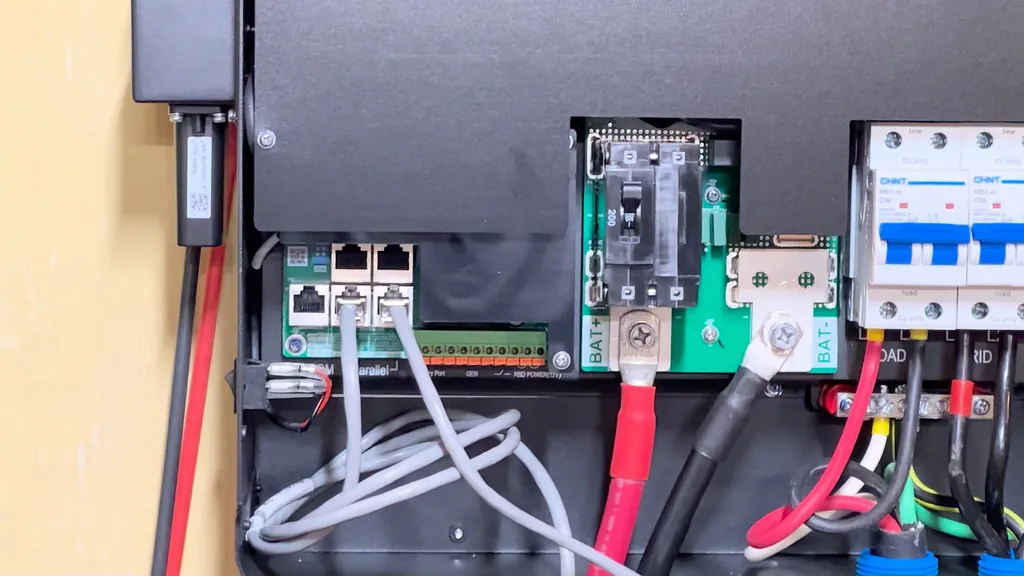 Communication cables plugged into the inverter ports.