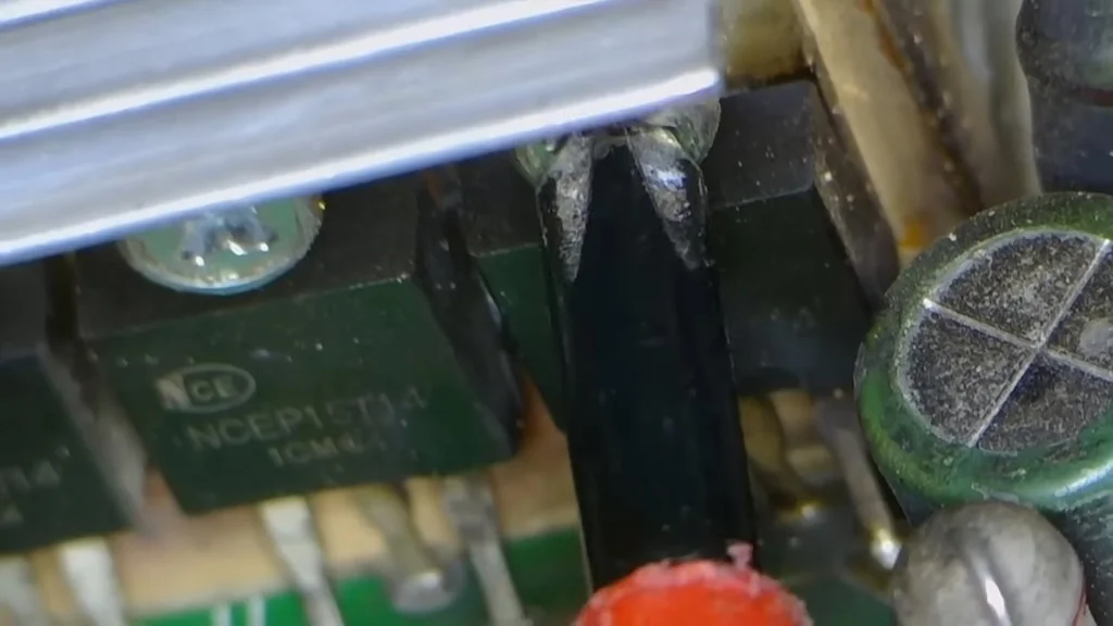 Close-up of NCEP15T34 transistors and capacitor