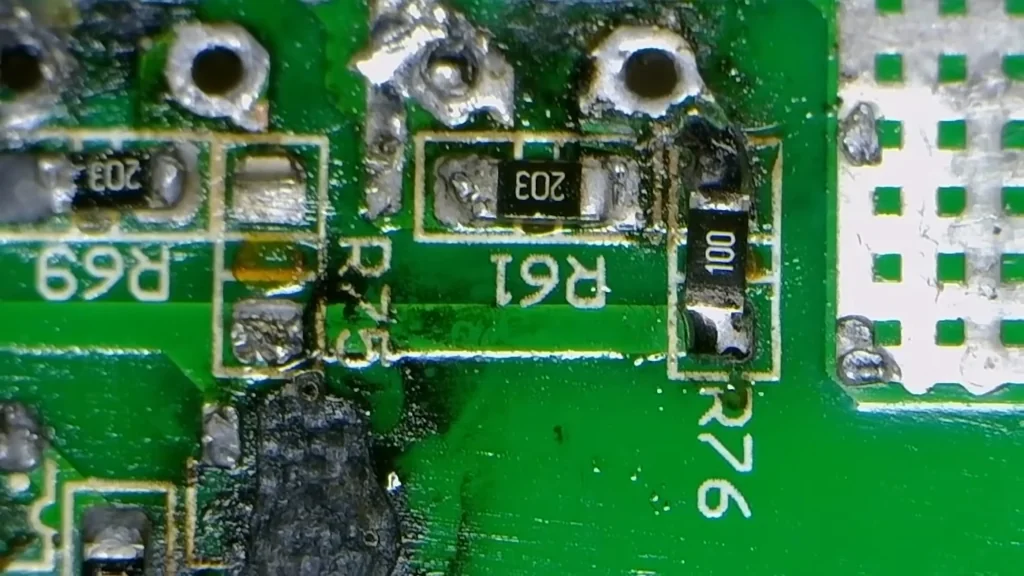 Close-up of damaged PCB resistors