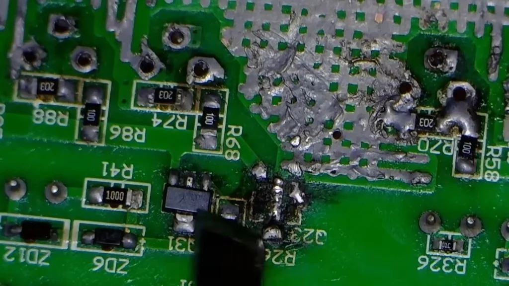 Close-up of severe PCB burn damage