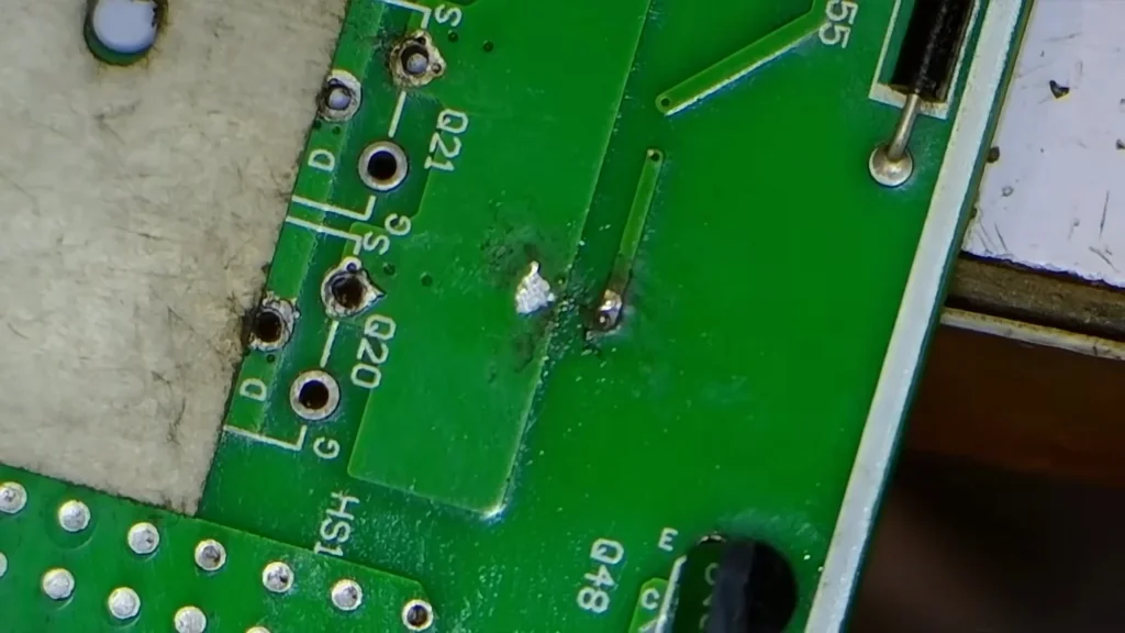 Close-up of desoldered component footprint