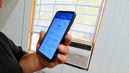 Four-way electrical receptacle held in hand