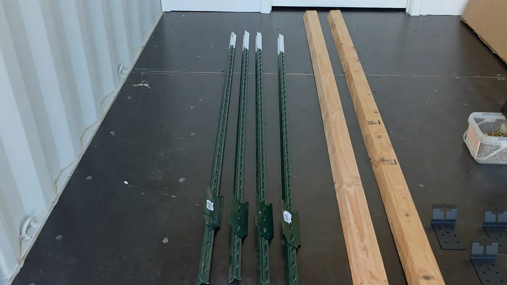 Two 2x4 wooden boards with 30-degree angled edges resting on a workbench.