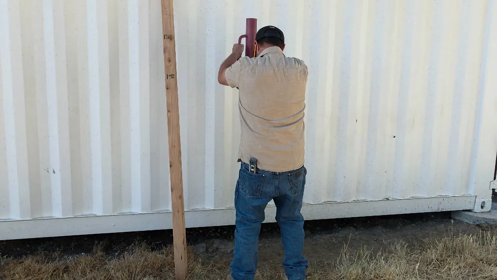 Two wooden 2x4 rails with angled edges positioned for assembly.