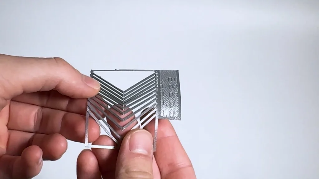 Hands holding flexible 3D printed part
