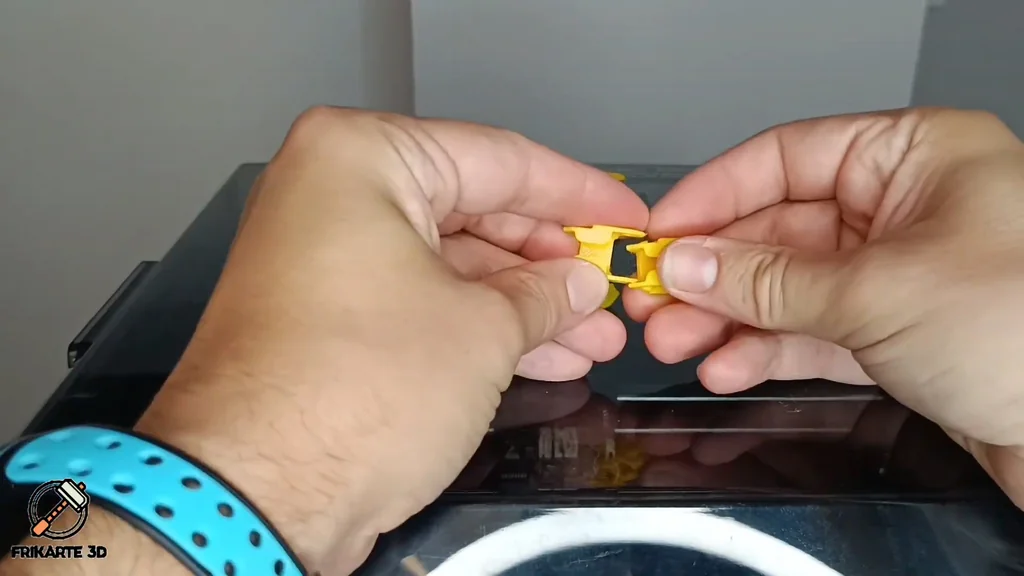 Snapping the new yellow chain links together