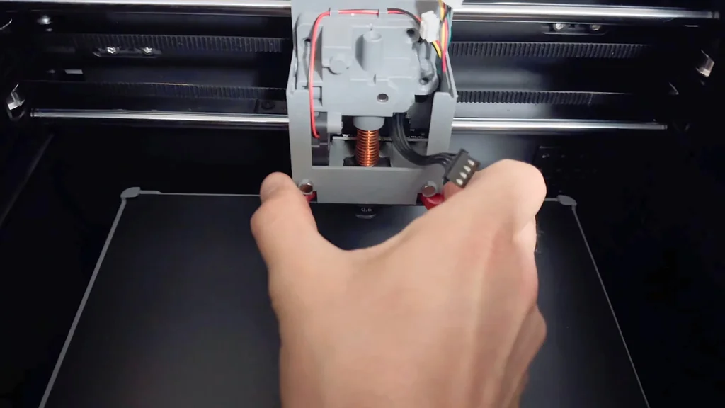 Removing the three hotend screws