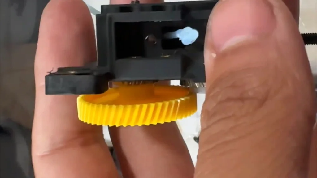 Blue filament stuck in extruder gear