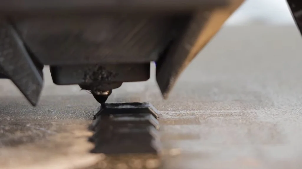 Nozzle extruding material