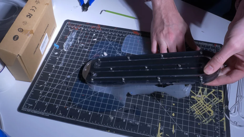 Handling assembled manifold on cutting mat