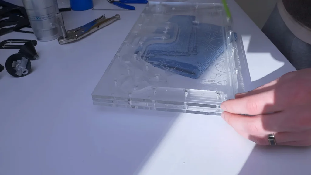 Assembling clear acrylic manifold layers