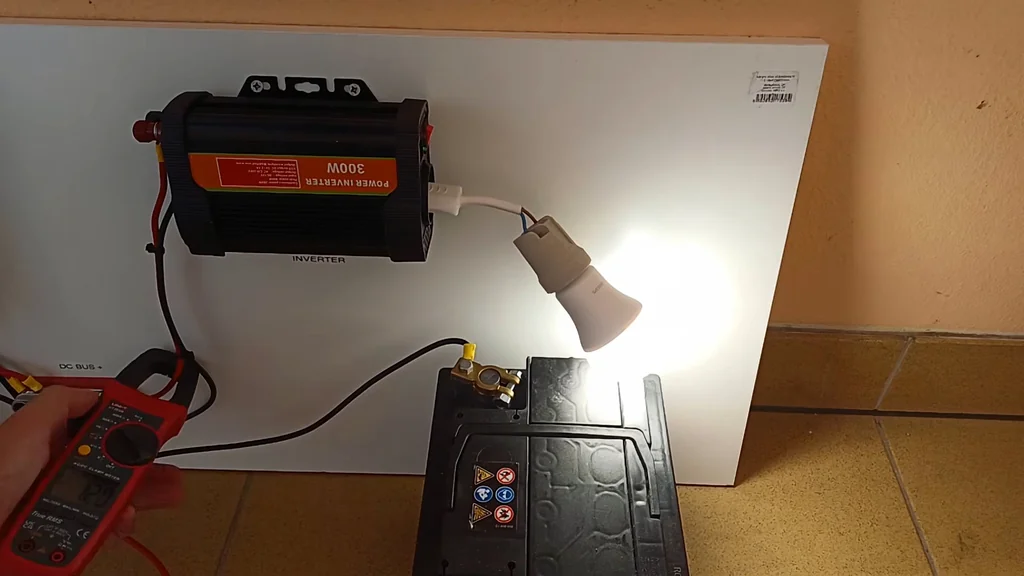 Light bulb connected to the power inverter for testing