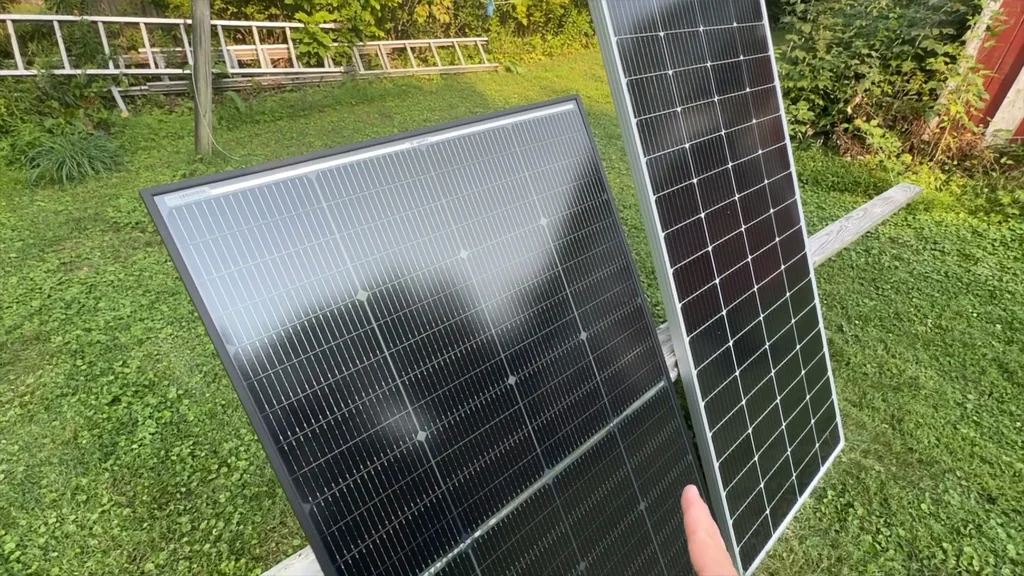 Two rigid solar panels on a wooden bench