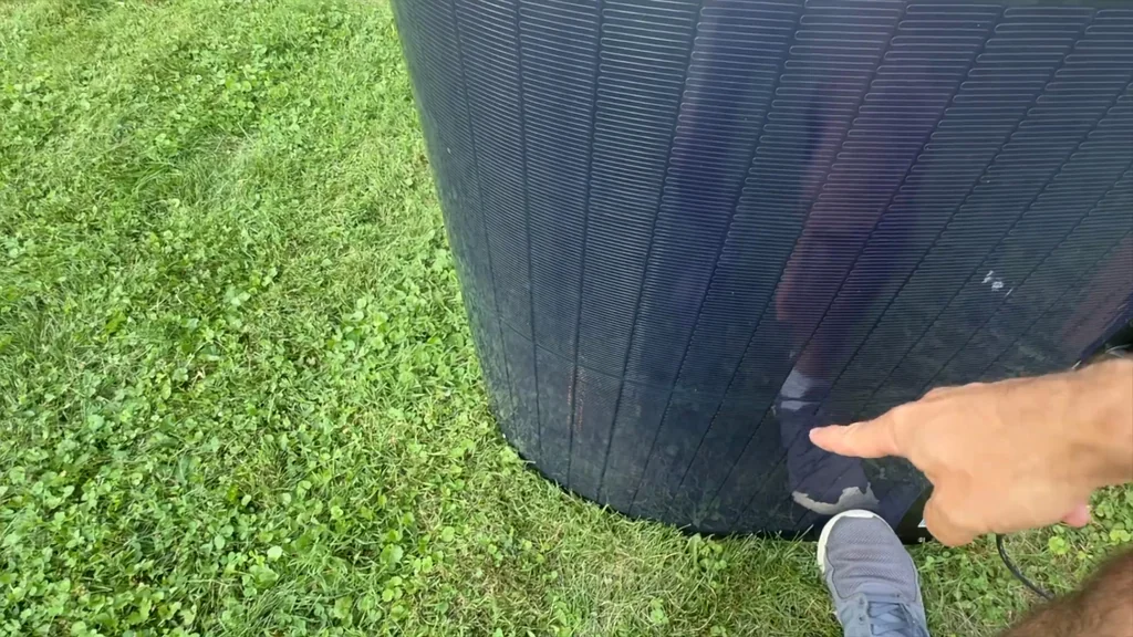 Hand pointing at the flexible solar panel