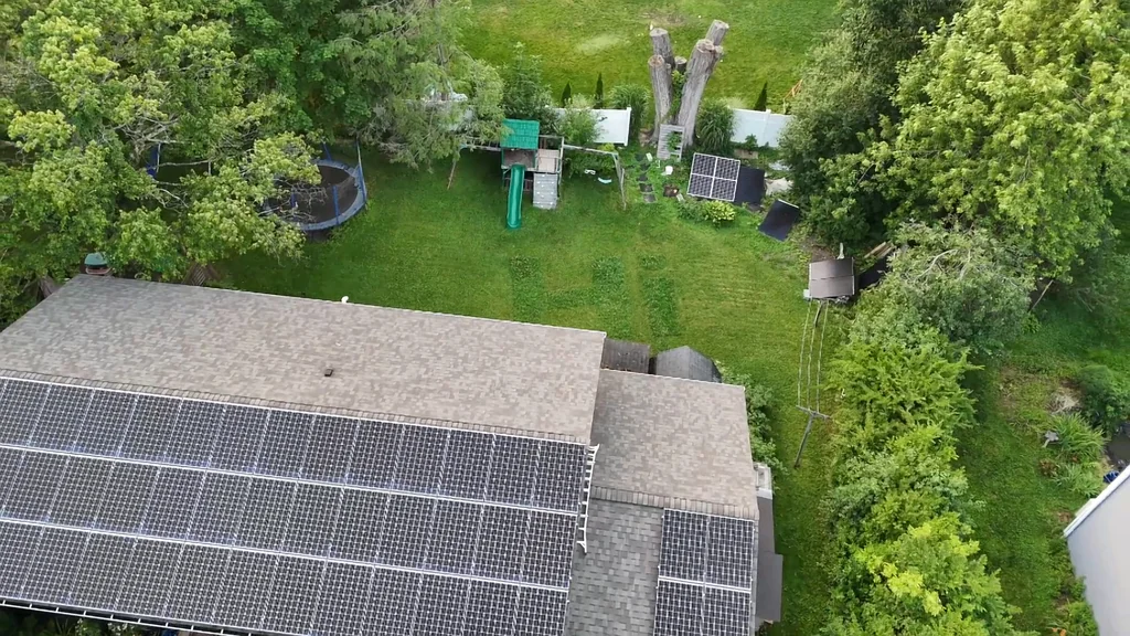 Aerial view of a house with solar panels