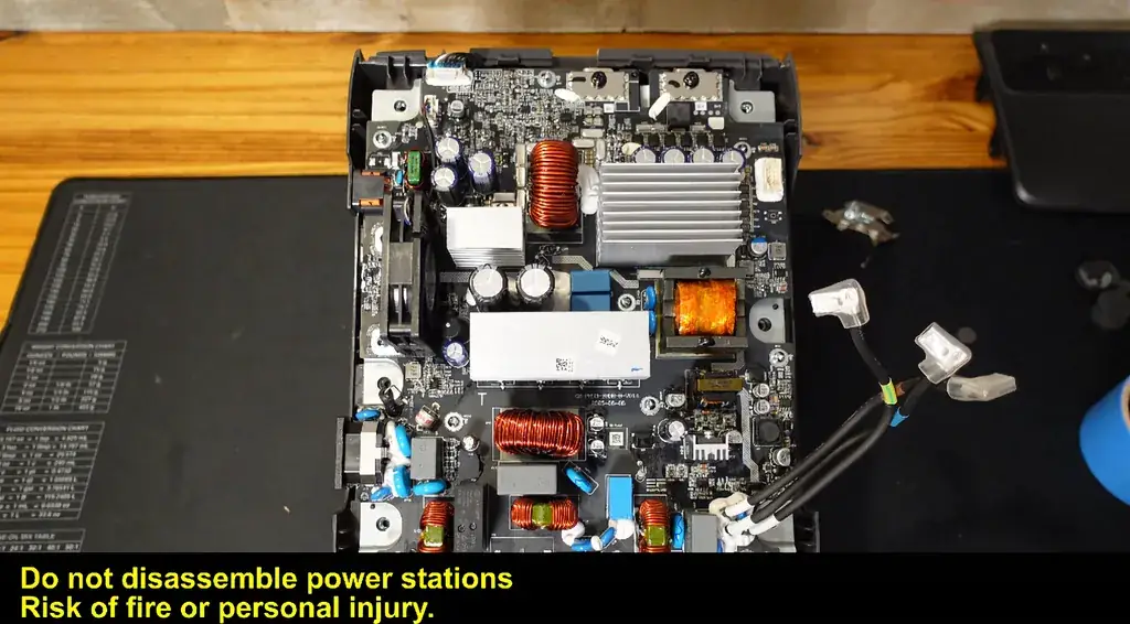 Internal view of the main circuit board with inductors and cooling fan