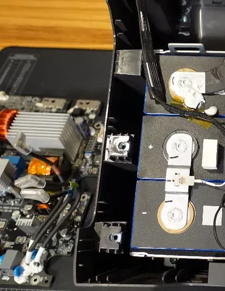 Steel end plates and stainless steel bands securing the battery cells