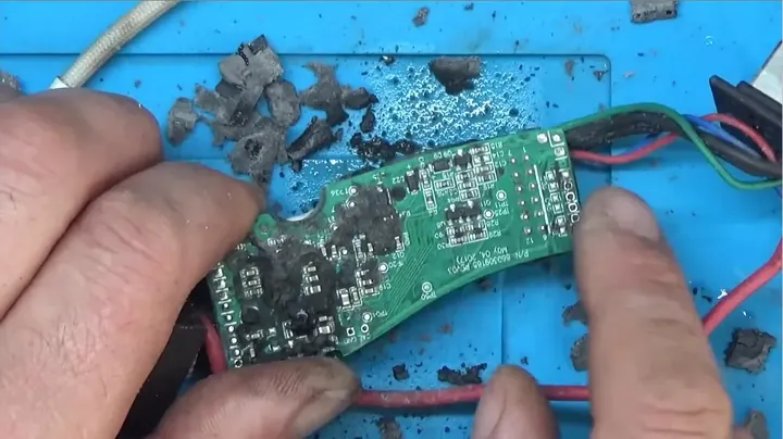 Scraping soft silicone potting compound from circuit board using dental pick