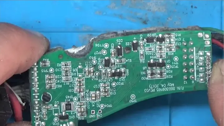 View of scraped control board assembly removed from plastic housing