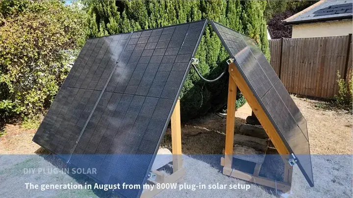 Four JA Solar modules installed on two angled timber ground frames in a residential yard