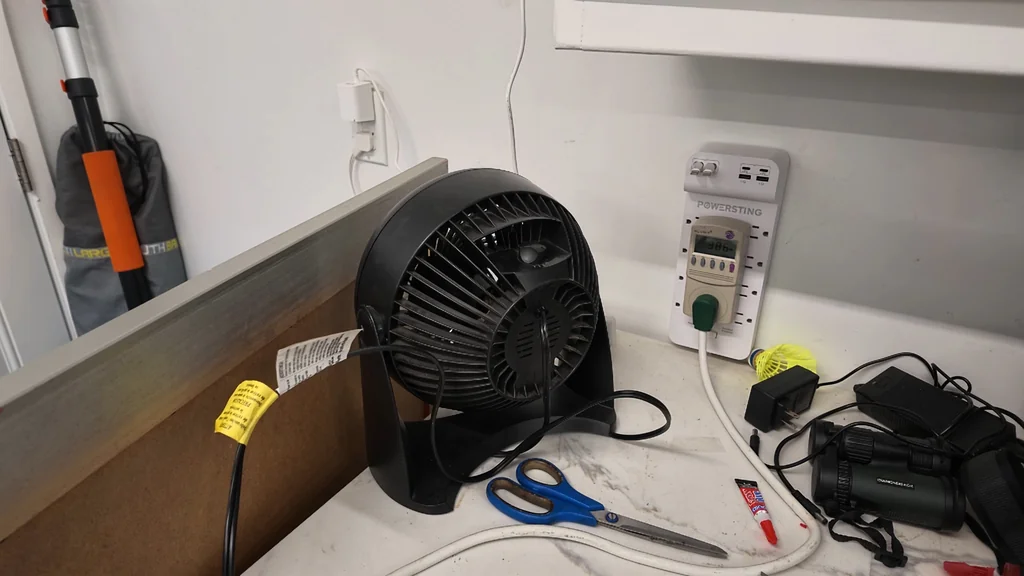 Hand plugging the system into the wall