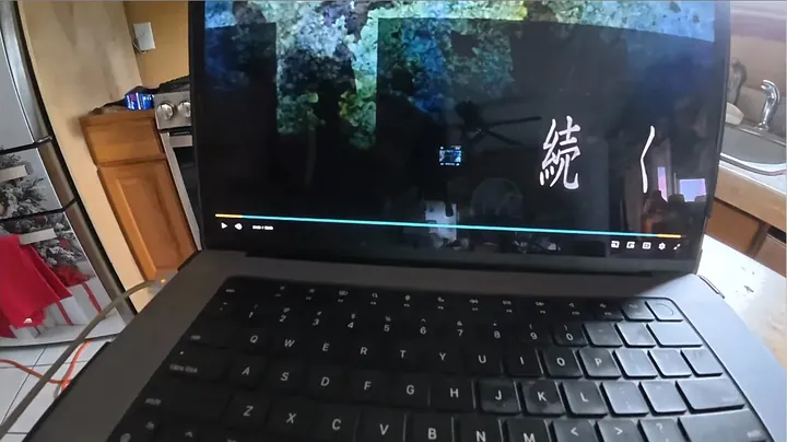 Laptop screen and output cords connected to power station