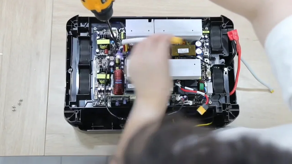 Using a mini drill on the circuit board