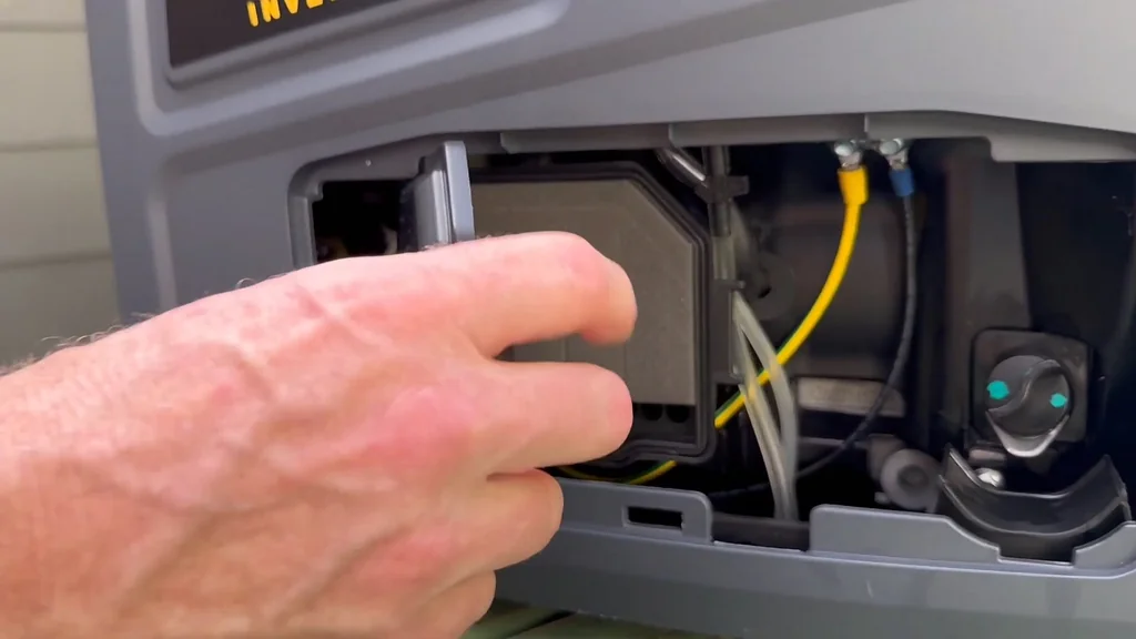 Man opening the air filter compartment