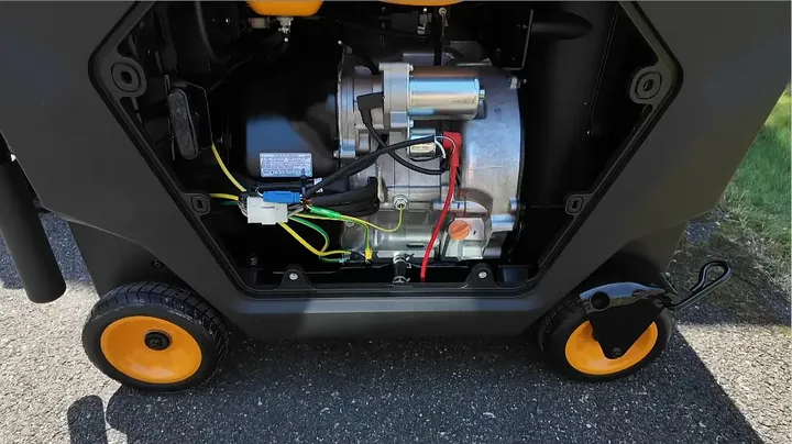 Open side panel of the Gidrox engine bay showing the oil fill cap and drain tube