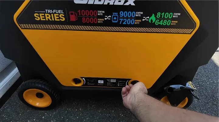 Hands removing the Gidrox side service panel to expose internal wiring and components