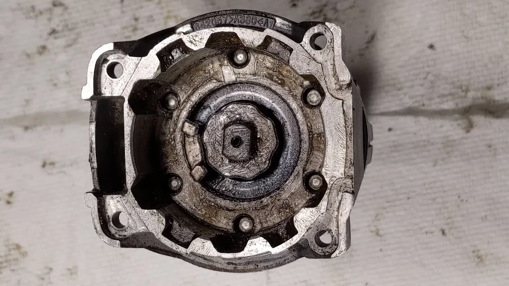 Applying grease to gear teeth
